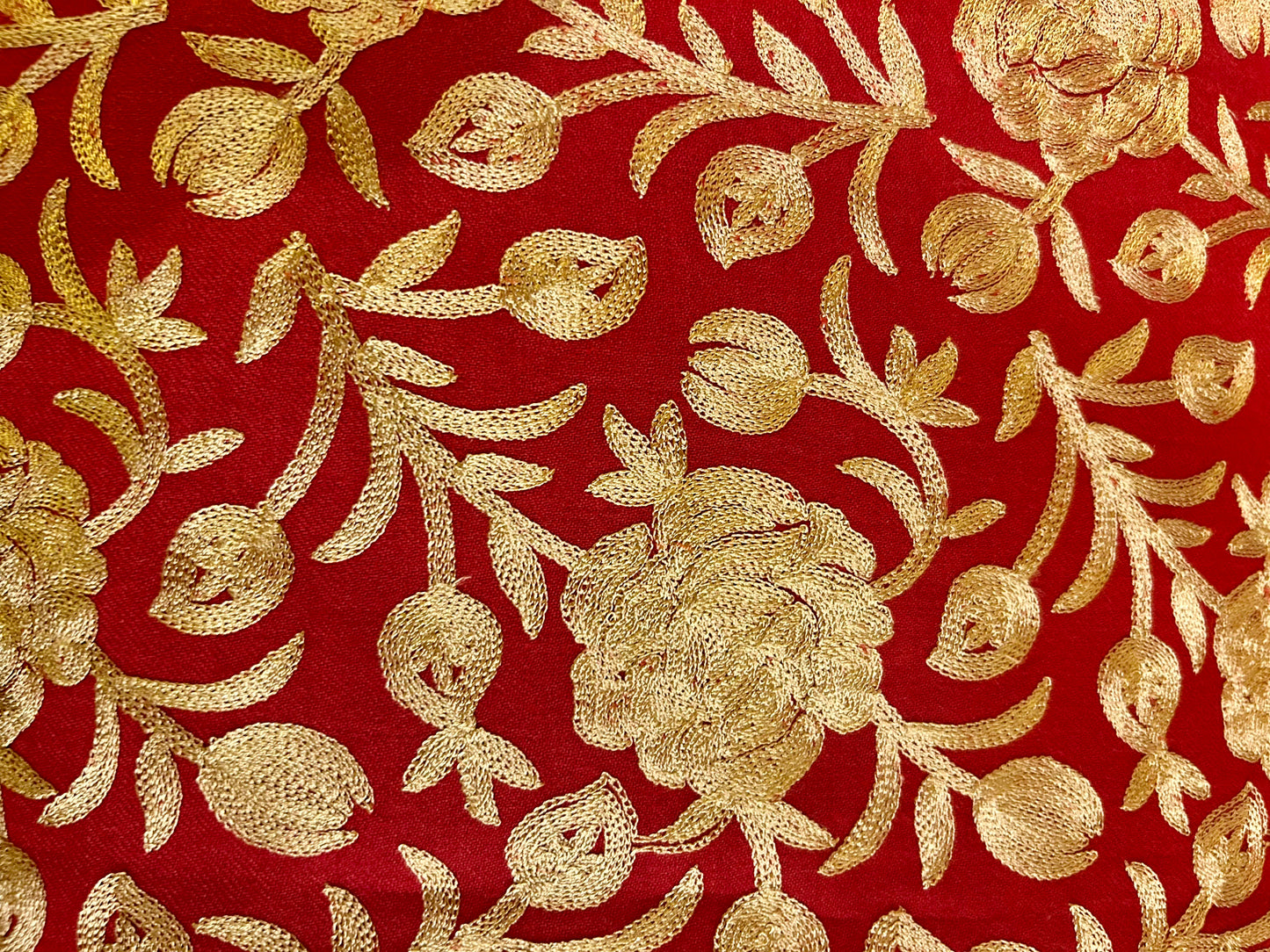 Gold floral embroidery on a red stole